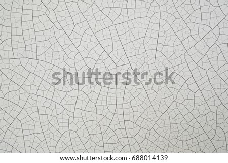 CLOSE UP OLD WHITE CRACKED PAINTED SURFACE Royalty-Free Stock Photo #688014139