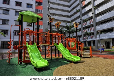 Colorful playground for childrens in public housing block. 