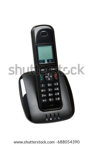 Modern black radiotelephone at dock station isolated on white background Royalty-Free Stock Photo #688054390