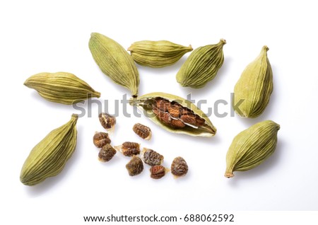 Top view close up photo image of group of cardamom isolate on white background, pods surface pattern, seeds skin texture Royalty-Free Stock Photo #688062592
