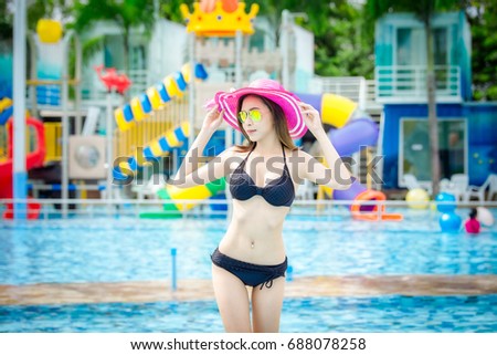 Young woman in the swimming pool,woman asia thailand