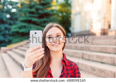 young girl makes selfie