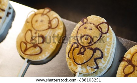 Pancake with cartoon on the top. This is the public food in Thailand. The picture concepts are celebrated, food, children.