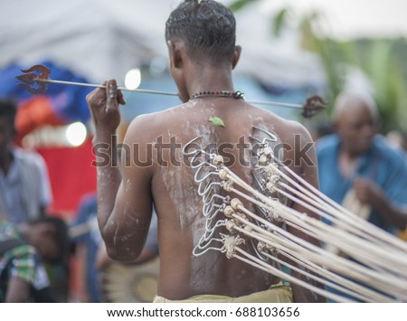 The picture of an India guy, at a Thaipusam festival.