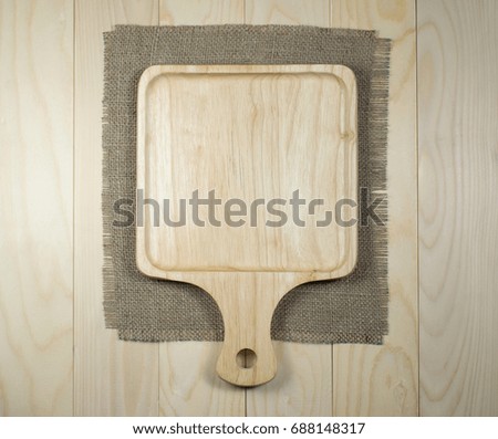 wooden cutting board on a wooden table 