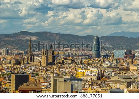 Aerial view of Barcelona city with Sagrada Familia and Agbar Tower in background, Spain.