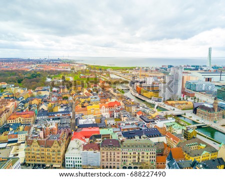 Aerial Malmo city view from above with harbour, turning Torso and North sea Royalty-Free Stock Photo #688227490