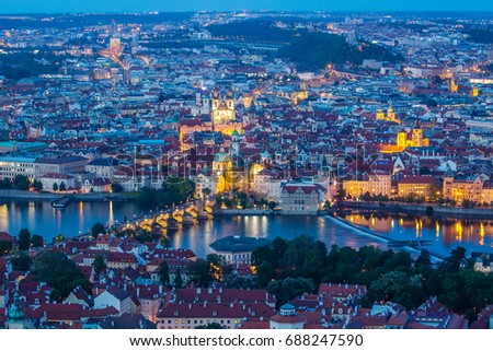 Prague at twilight blue hour, view of Charles Bridge on Vltava with Mala Strana and Old Town.
