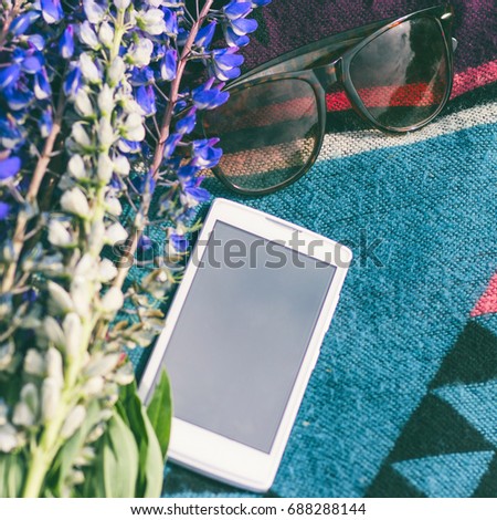 summer screensaver from a mobile phone with bright colors and glasses 