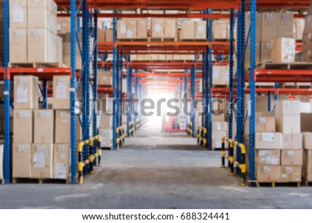 Warehouse storage of retail merchandise shop. Blur background.