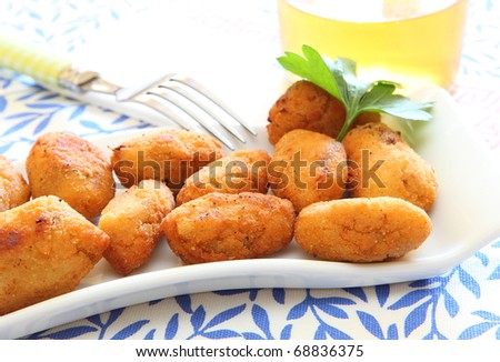 ham and cheese spanish croquette with glass of beer Royalty-Free Stock Photo #68836375