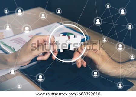 man holding pieces of jigsaw puzzle. business matching concept. crowd sourcing. freelancer. teleworking. Royalty-Free Stock Photo #688399810