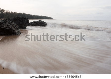 Long Exposure in Beach.Soft water movement on the beach sand. located in Terengganu, Malaysia. ( Taken Slow Speed Shutter )