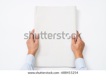 Businessman is holding blank newspapers on isolated background.