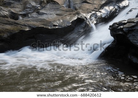 Waterfall in jungle, Chiangmai, Thailand.