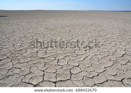 Cracked soil in Makgadikgadi pans, Botswana, Africa Royalty-Free Stock Photo #688422670