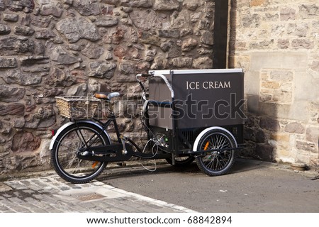 An ice cream cart is built on a bicycle in Edinburgh. Royalty-Free Stock Photo #68842894