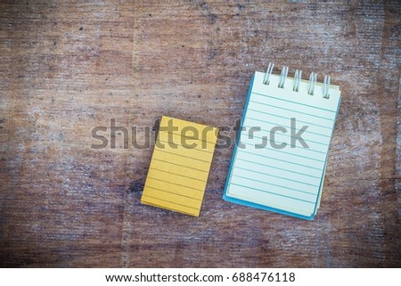 Notepad on plaster board  white background. using wallpaper or background for education photo.
