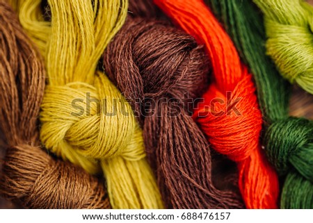 Multicolor threads for embroidery cross-stitch, mulina. Color background.