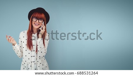 Digital composite of Happy woman talking on the phone against blue background