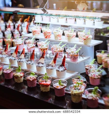Closeup of sweet tasty dessert on modern table buffet. tiramisu dessert in glass.