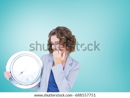 Digital composite of Woman holding clock in front of blue background