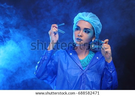 Chemistry Asian Doctor Woman with Fashion Make up fancy lab test dress, studio lighting black dark background, safety gear hygiene hat and tube glass