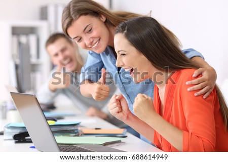 Happy employee being congratulated by colleagues after success at office Royalty-Free Stock Photo #688614949
