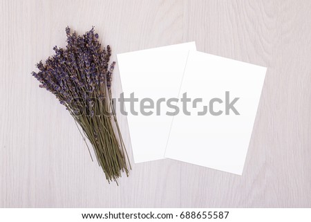 Creative mock up layout made of lavender branches with copy space on table homemade flat lay. White paper. Postcard
