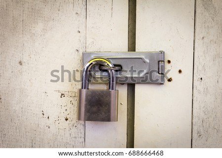 Locked padlock with at door.select focus Royalty-Free Stock Photo #688666468