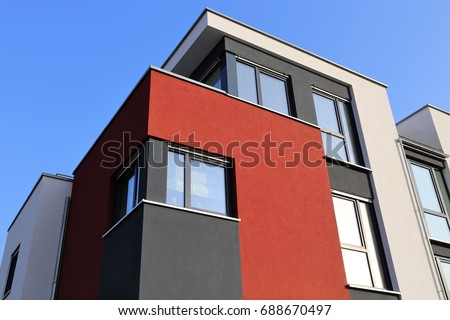 Residential home with modern facade painting, exterior shot Royalty-Free Stock Photo #688670497