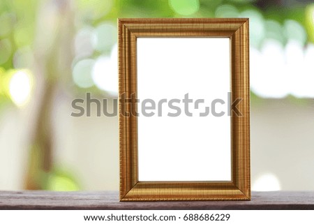 Modern Picture Frame placed on a wooden floor hand have copy space to work input your idea.