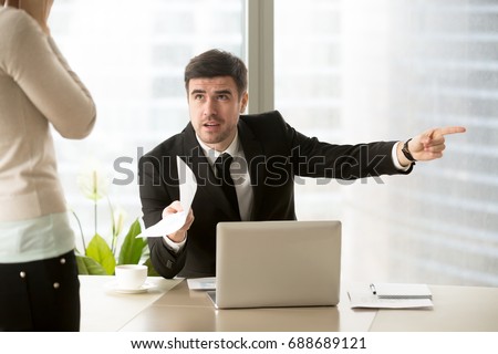 Angry company executive dismisses employee for paperwork error, mad ceo discharges ineffective manager after bad work, furious chief fires subordinate dissatisfied with poor performance, youre fired Royalty-Free Stock Photo #688689121