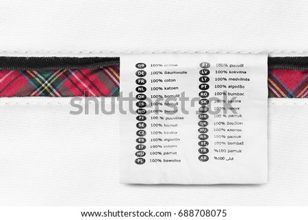 Fabric composition clothes label on white cotton as a background