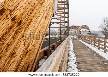 Abstract image of wooden walkway bridge. Wooden framed bridge. Outdoor industrial architectural bridge crossing. Bridge roadway.