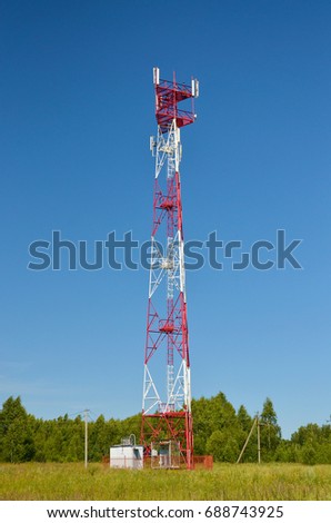 Mobile phone cellular telecommunication radio tv antenna tower. Cell phone tower against blue sky. Transmitter