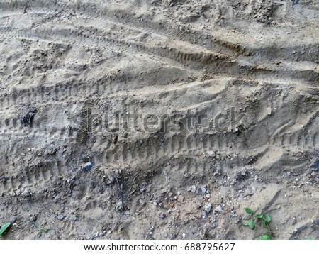 Bike tracks in the sand.