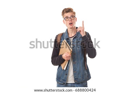 Portrait of college nerd holding notebooks against white background
