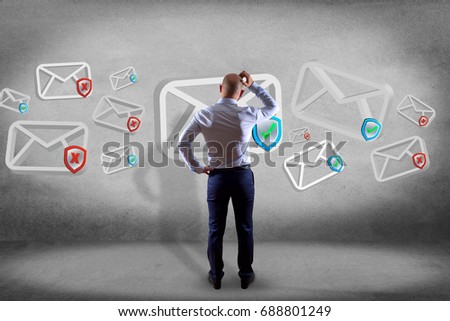 View of a Businessman in front of a wall with Approved email and spam message displayed on a futuristic interface - Message and internet concept