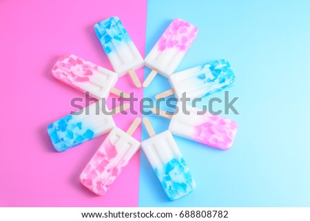Fruit Ice cream stick , popsicle , ice pop or freezer pop with copyspace on blue and pink pastel background or texture