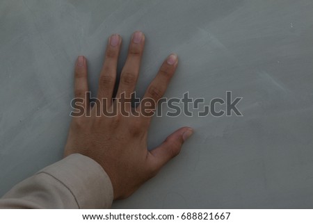 Hands placed on the wall