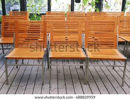 many  brown chairs in the garden