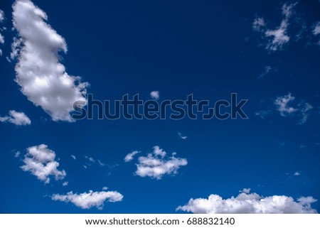 White clouds and blue sky textured background