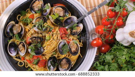 Top down view of delicious Italian spaghetti alle vongole (clams) Royalty-Free Stock Photo #688852333