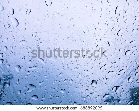 The rain on the glass after the heavy rain has been finished.