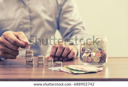 Save money for retirement and account banking for finance concept, Investor and accountant, saving, coin, retirement, financial concept Royalty-Free Stock Photo #688902742
