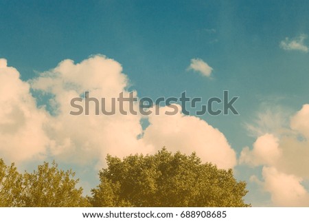 Toned sky with clouds. Vintage background.