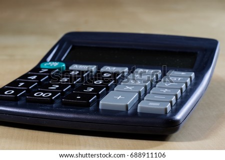 Bills, documents and papers with calculator. Office of the accounting office. Wooden table.