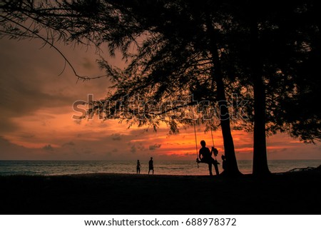 Family silhouette, Sea Life, Swing, Sea View at Mai Khao Beach Phuket Thailand