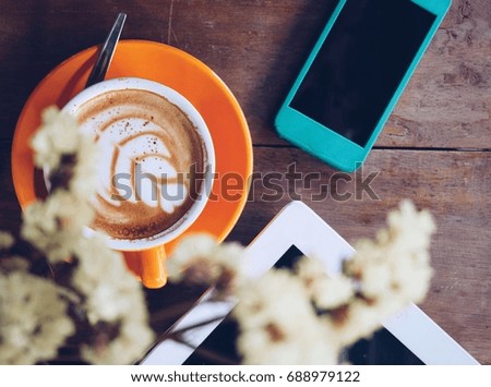 Coffee cup and laptop smartphone